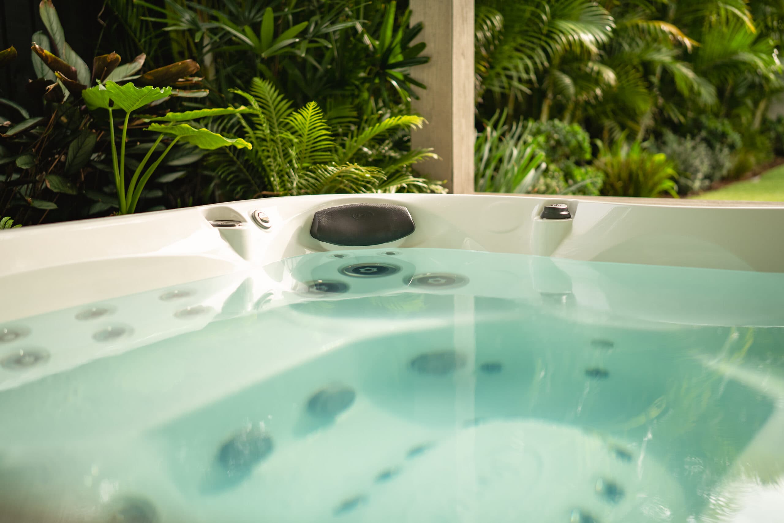 Close view of the spa surrounded by lush green foliage